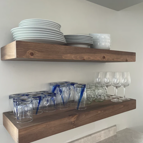 glasses and dishes on floating shelves 