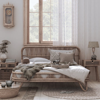 a staged bedroom with a beige monochrome palette and natural woods